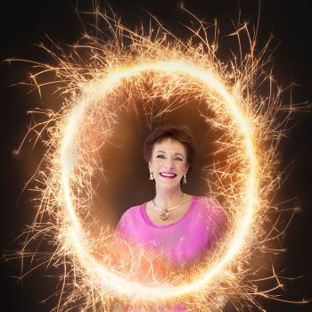 brand portrait of vitality expert standing in the middle of a sparkler circle