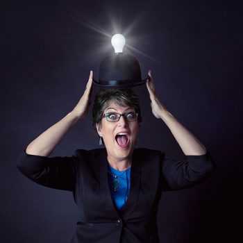 brand portrait of web designer wearing a hat with light bulb shining brightly